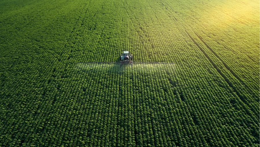 bird's ey view of pesticide being sprayed on crops